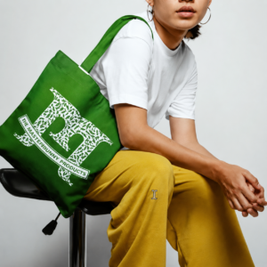 The medium gray long sleeve shirt with person sitting in yellow pants, white shirt, with green Bag